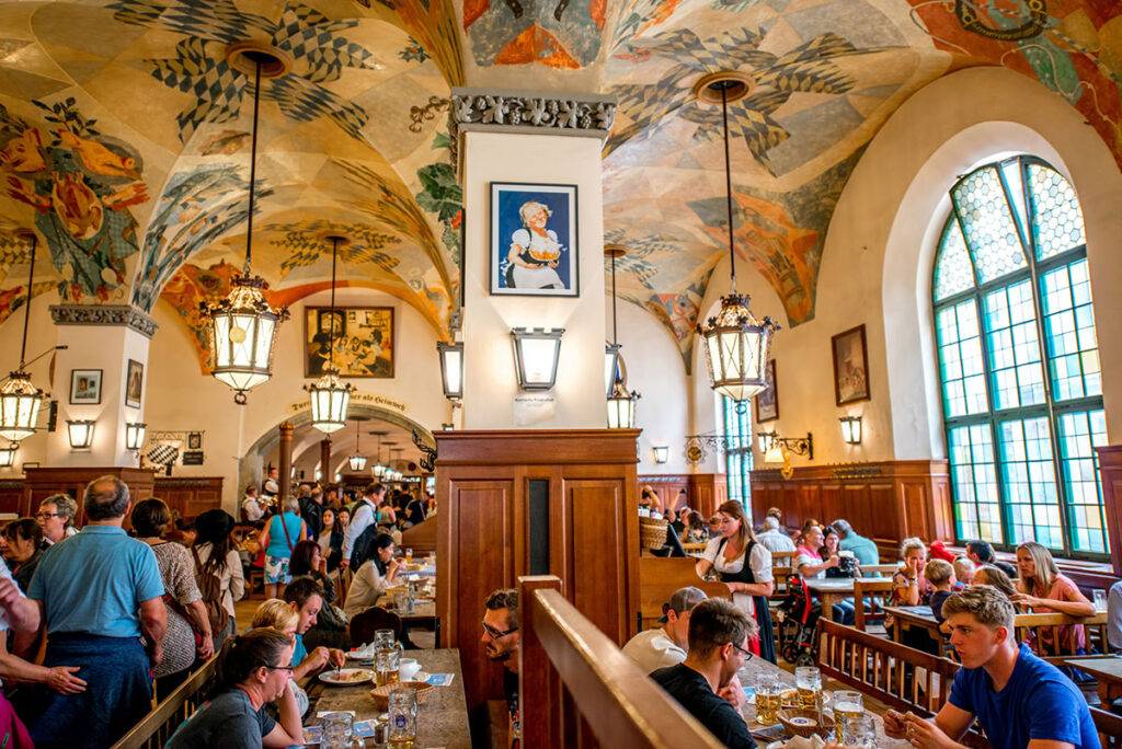 The inside of Hofbrahaus in Munich, showing one of the rooms full of people