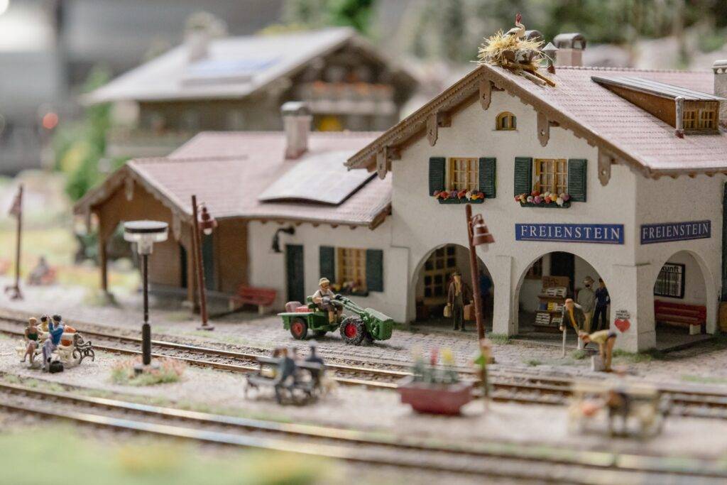 A close up of a miniature train station